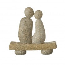 Stone couple on a bench